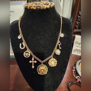 Gold toned Guess Charm necklace
